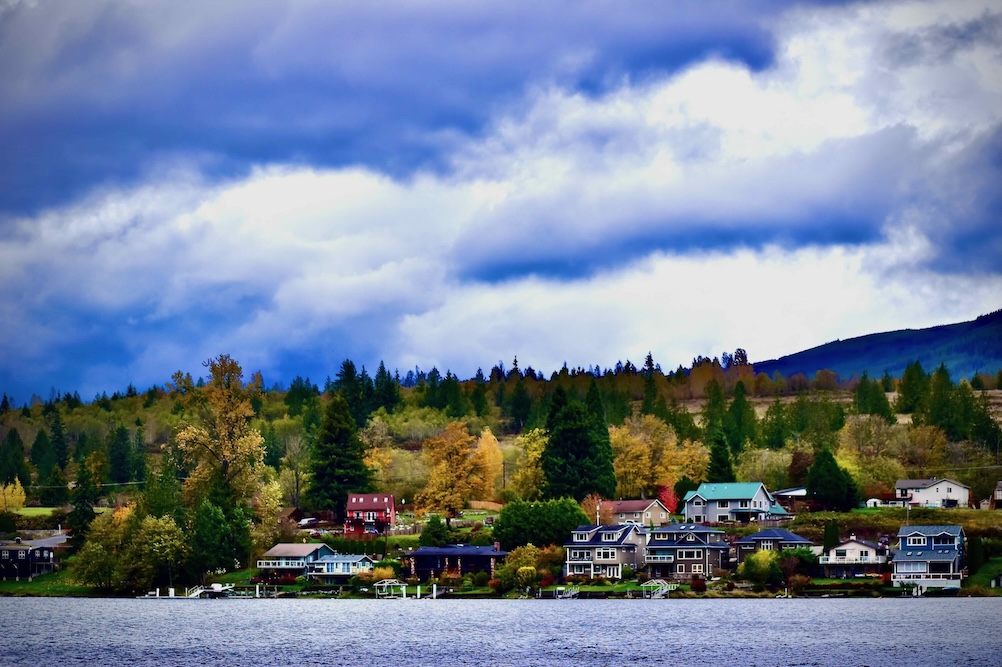 Colorful homes set against a lake