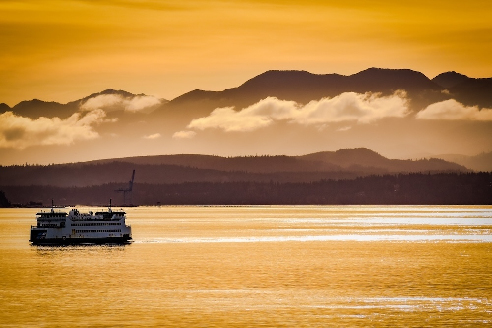 Golden Ferry with Olympic mountains in background